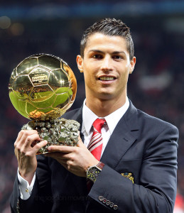 Image #: 6653242 Manchester United's Cristiano Ronaldo poses with the Ballon d'Or before kick off. PA Photos /Landov